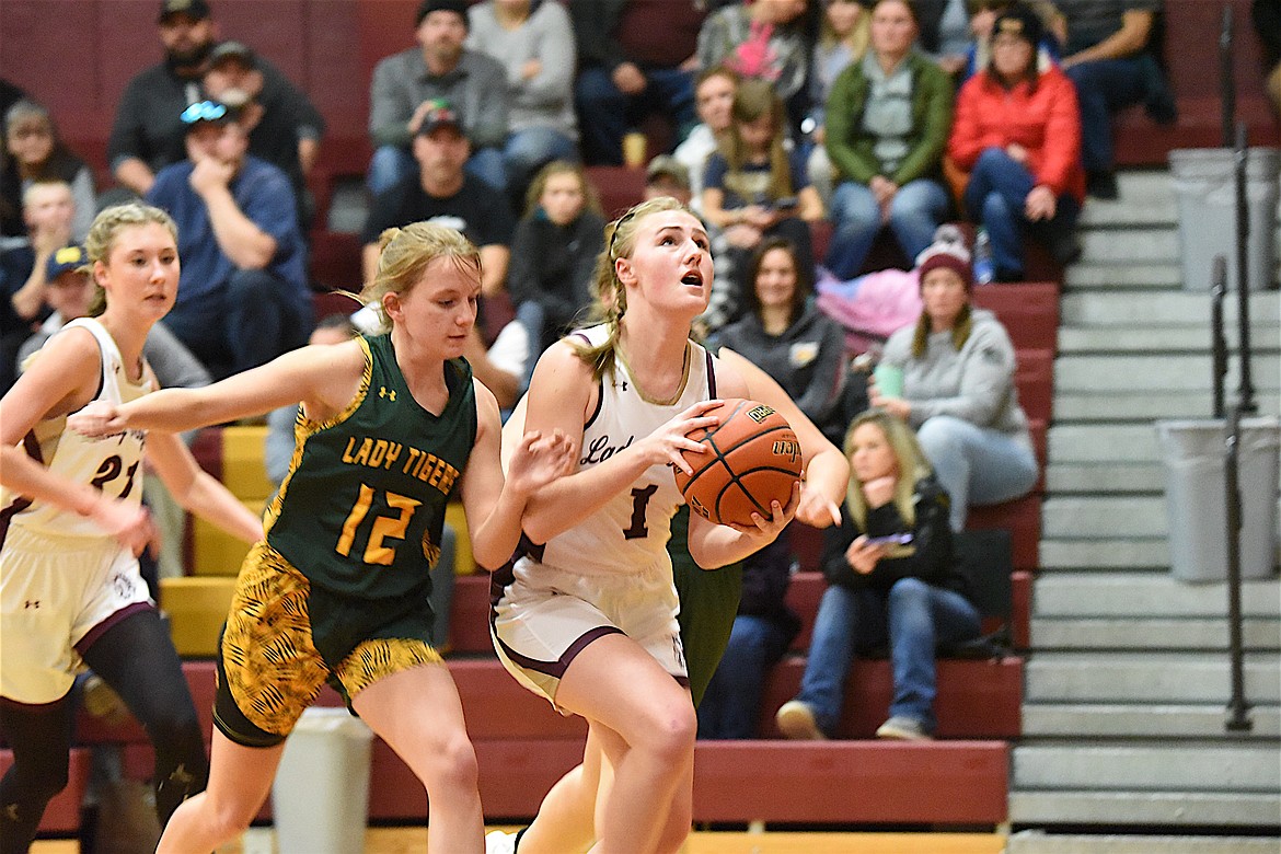 Troy's Autumn Fisher heads to the basket on Saturday, Dec. 9, against St. Regis. (Scott Shindledecker/The Western News)