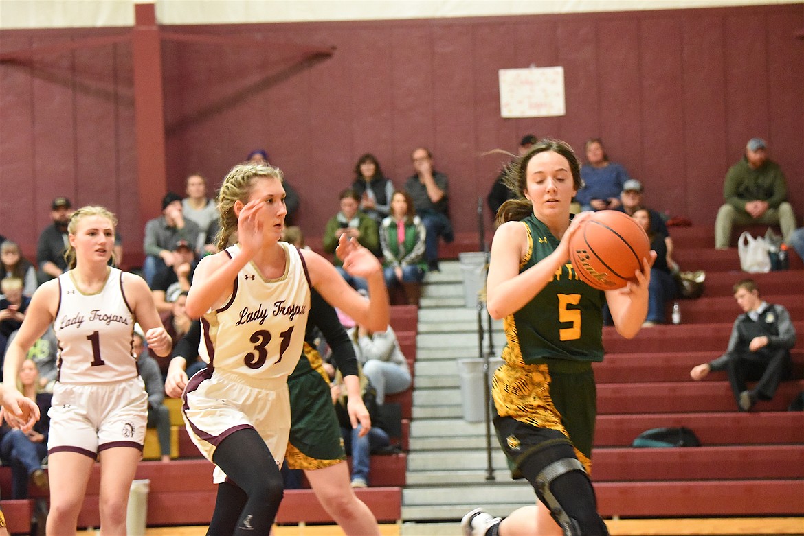 Troy's Jaylee Meyers hustles back on defense on Saturday, Dec. 9, against St. Regis. (Scott Shindledecker/The Western News)