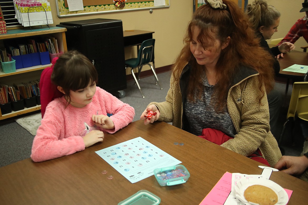 Cassidy Madsen and her mom, Dawn, play Watch Out Addition at the recent Math Rocks! family fun night. Hope students, staff and families played math games, enjoyed dinner and had a lot of fun at the event.