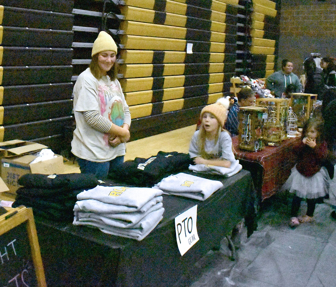 Tawnee Hebden and her daughter offer Royal Knights T-shirts at the Royal Intermediate School bazaar Wednesday. The proceeds go toward extra educational activities for Royal students, Hebden said.