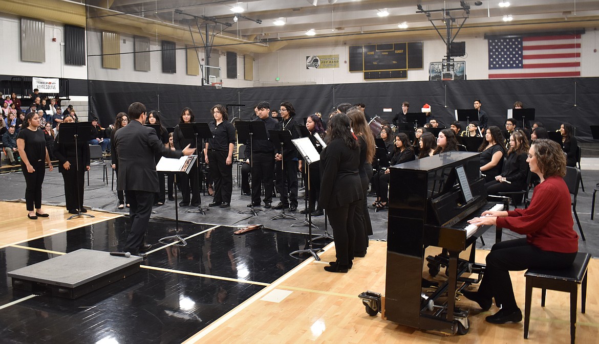 The Royal High School choir, directed by Erich Mietenkorte and accompanied by pianist Heather Jenks, sings “Snow on Snow” at the Royal Music Department Christmas concert Wednesday.