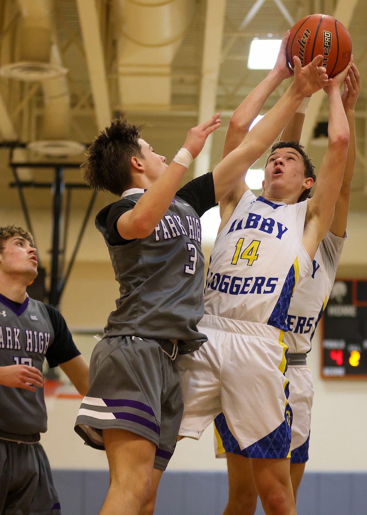 Libby's Tyler Andersen battles against Park High in the Western A Tip-off in Frenchtown on Friday, Dec. 8, 2023. Andersen totaled 35 points in both games to help the Loggers win both games. (Jeremy Weber/Bigfork Eagle)