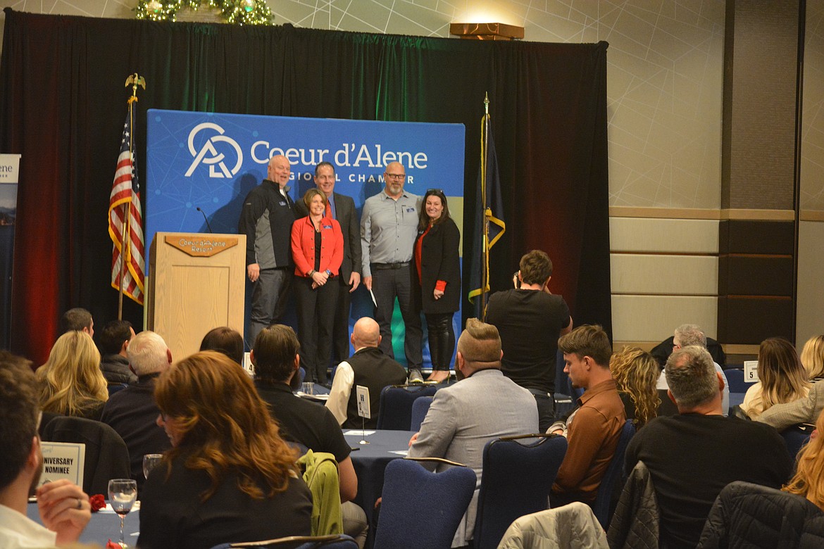 Rick Rasmussen, CEO of Northwest Specialty Hospital, left, was presented with the Ed Abbot Volunteer of the Year. Also pictured, Jody Azevedo, center and Troy Tymesen.