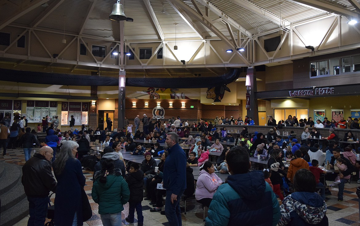 Community members enjoy refreshments and each other's company in the Wahluke High School commons for the Living Nativity Project event.