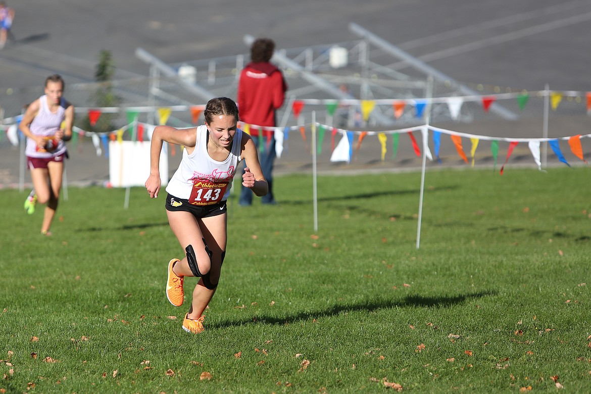 Moses Lake senior Paige Perkins (143) runs uphill during the Moses Lake Invitational at the Gorge on Oct. 12.