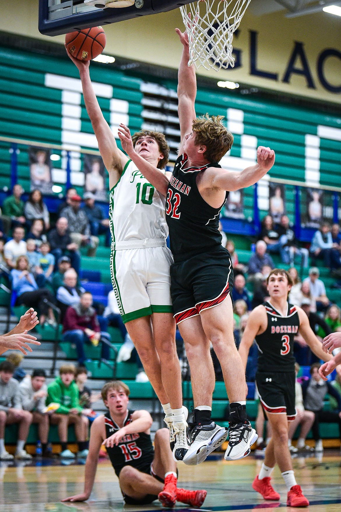 Glacier's Brantly Salmonsen (10) drives to the basket against Bozeman's Quaid Ash (32) in the first quarter at Glacier High School on Friday, Dec. 15. (Casey Kreider/Daily Inter Lake)