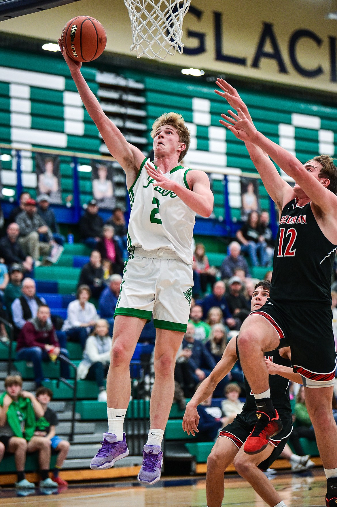 Glacier's Liam Ells (2) drives to the basket in the first quarter at Glacier High School on Friday, Dec. 15. (Casey Kreider/Daily Inter Lake)