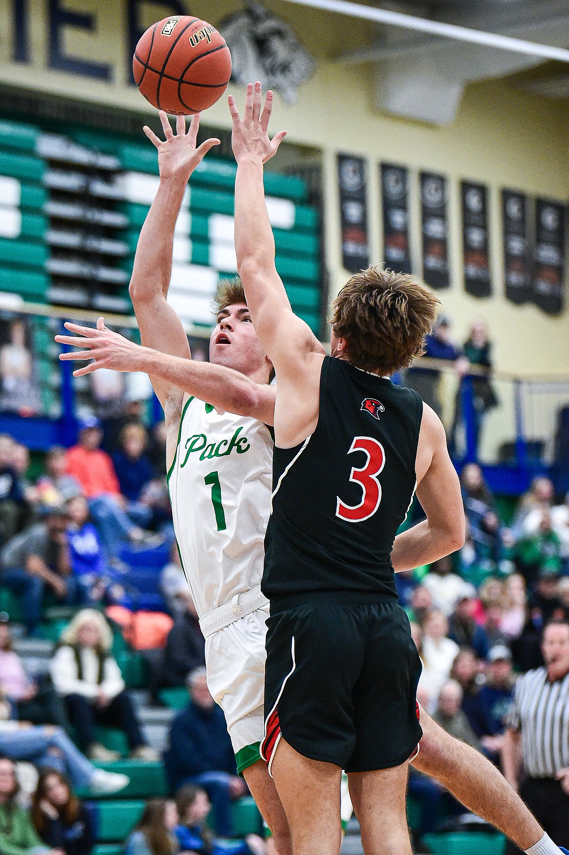 Glacier's Cohen Kastelitz (1) drives to the basket against Bozeman's Kash Embry (3) in the first quarter at Glacier High School on Friday, Dec. 15. (Casey Kreider/Daily Inter Lake)