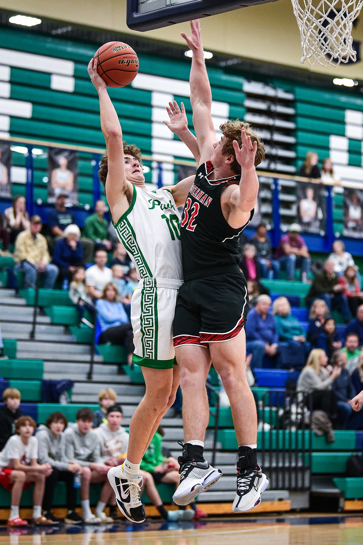 Glacier's Brantly Salmonsen (10) drives to the basket against Bozeman's Quaid Ash (32) in the first quarter at Glacier High School on Friday, Dec. 15. (Casey Kreider/Daily Inter Lake)