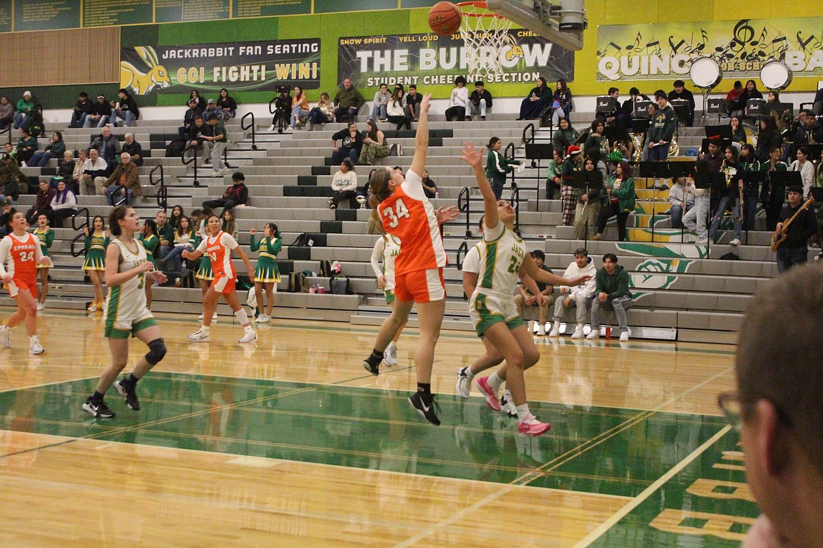 Ephrata Tigers guard Emily Ellsworth (34) puts the ball up against Quincy.