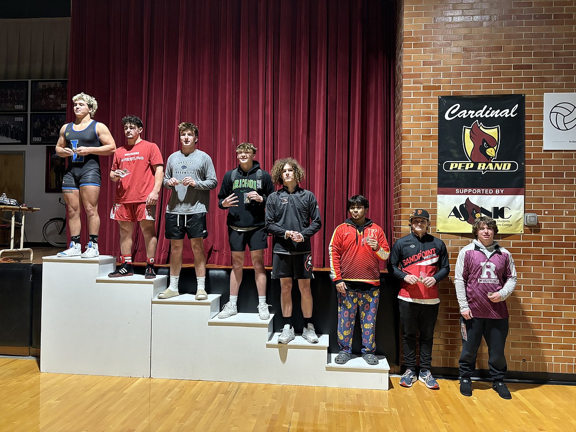 Sandpoint's Jorden Tyler (second from right) poses with his seventh-place medal from the Tri-State Inviational held in Coeur d'Alene on Friday and Saturday.