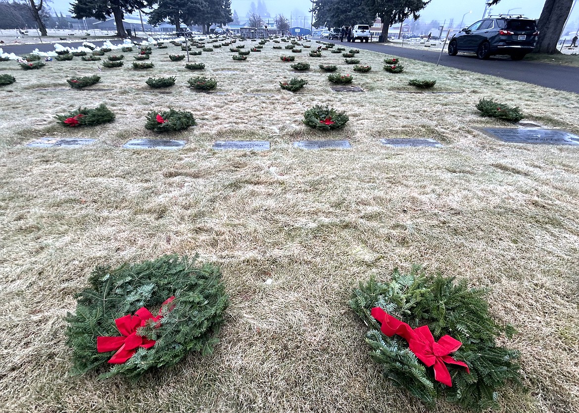 Wreaths decorate the gravesites of veterans at Coeur d'Alene Memorial Gardens on Saturday.