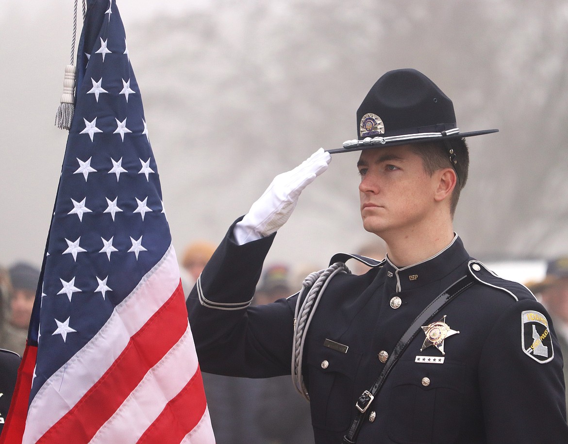 Idaho State Police Trooper Tim Myers salutes during the Wreaths Across America ceremony Saturday in Coeur d'Alene.