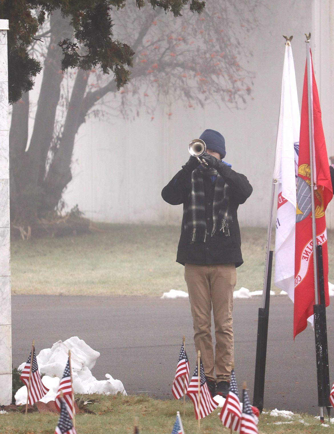 Jesse Harlan plays Taps during the Wreaths Across America ceremony Saturday.