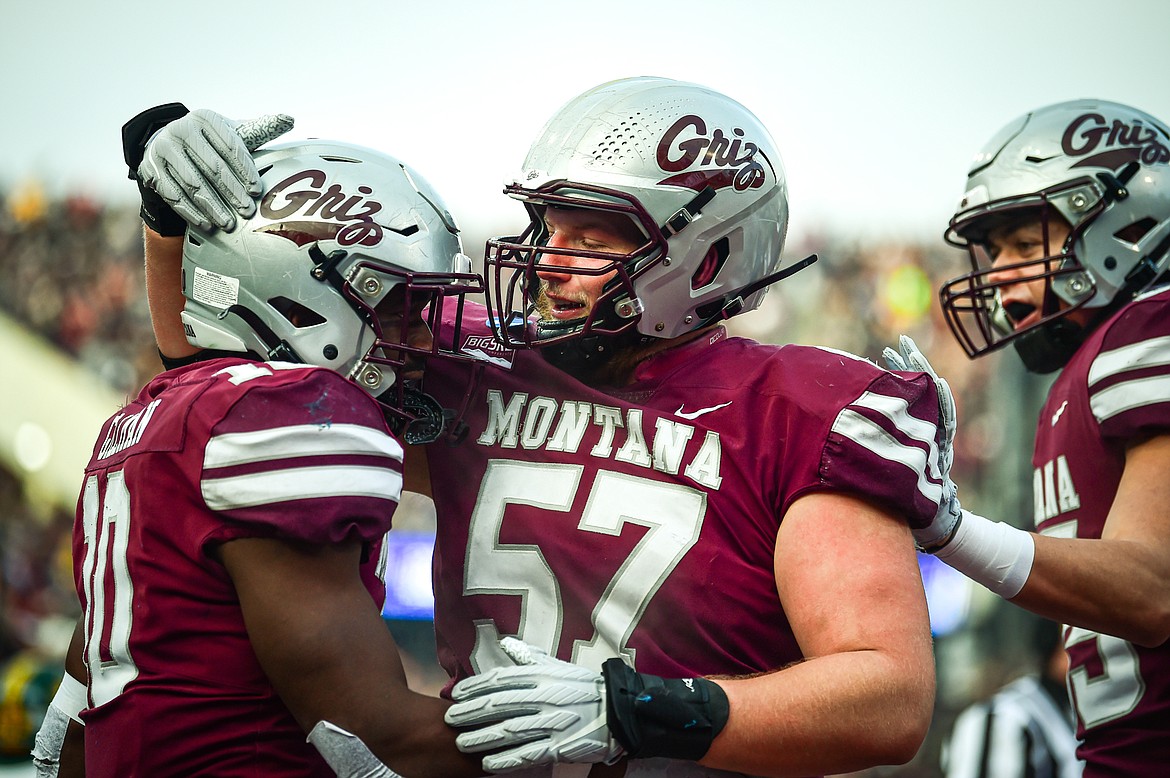 Grizzlies running back Eli Gillman (10) celebrates with offensive lineman AJ Forbes (57) after a 3-yard touchdown run in the second quarter against North Dakota State in the FCS semifinals at Washington-Grizzly Stadium on Saturday, Dec. 16. (Casey Kreider/Daily Inter Lake)