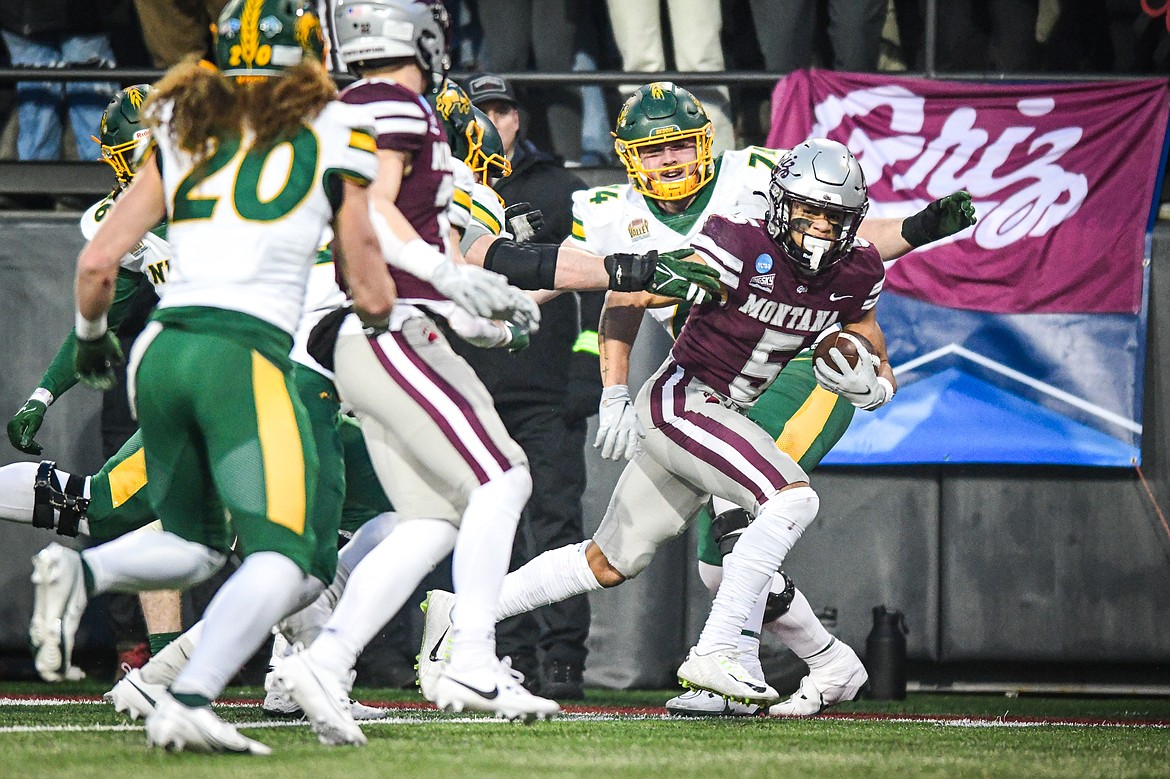 Grizzlies returner Junior Bergen (5) scores a touchdown on a 47-yard punt return in the fourth quarter against North Dakota State in the FCS semifinals at Washington-Grizzly Stadium on Saturday, Dec. 16. (Casey Kreider/Daily Inter Lake)