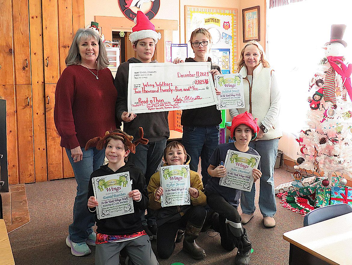 Yaak Elementary School students raised $2,025 to support area residents and families battling cancer. This year they raised money by reading and receiving pledges from the community. From left, back row, area teacher Sabré Burson-Alderete, seventh grade student Ely Oehlke (273 pages), eighth grade student Jedidiah Jewett (173 pages) and teacher's aid Kimm Bowcutt. From left, front, are sixth grade student David Bartlett (681 pages), third grade student Ryker Jewett (89 pages) and fifth grade student John Charland (350 pages). Absent is second grade student Roman Bridges (36 pages).