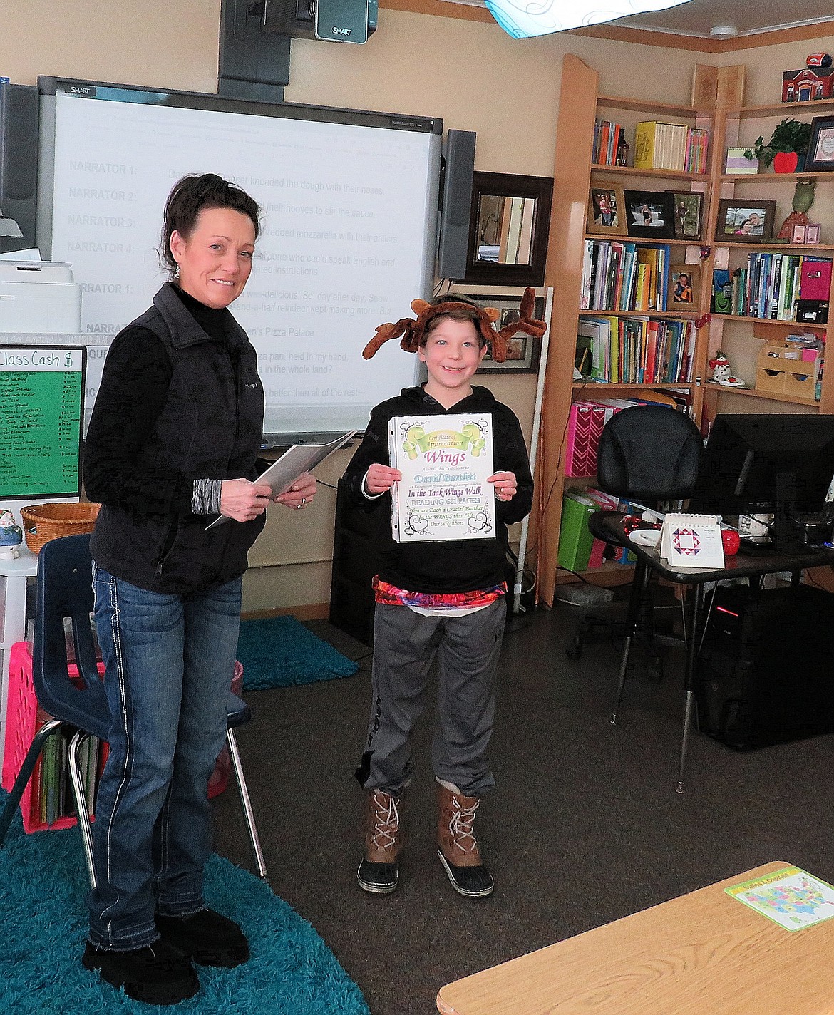 Yaak Wings organizer Roberta Deneau and sixth grade student David Bartlett.