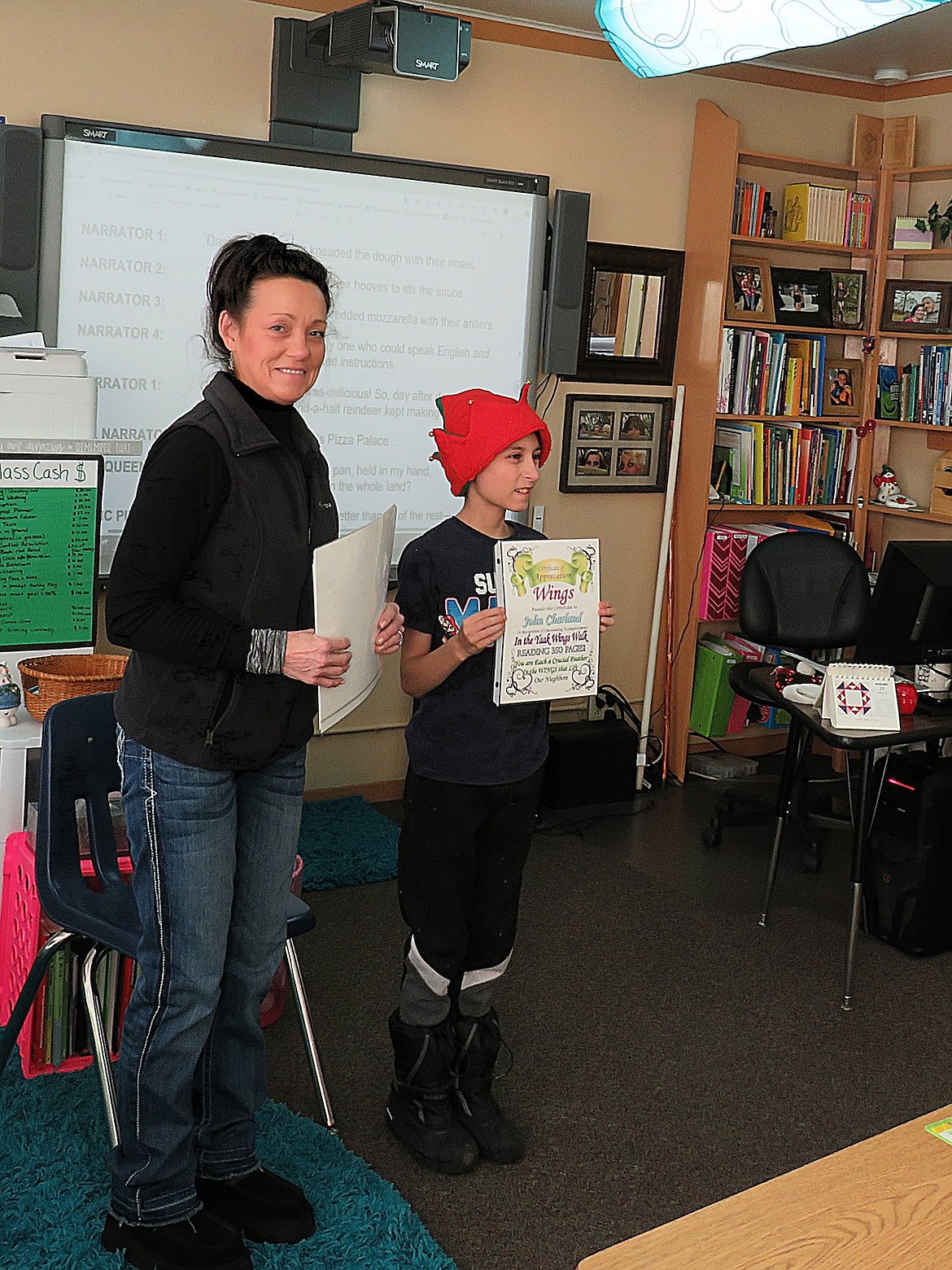 Yaak Wings organizer Roberta Deneau and fifth grade student John Charland.