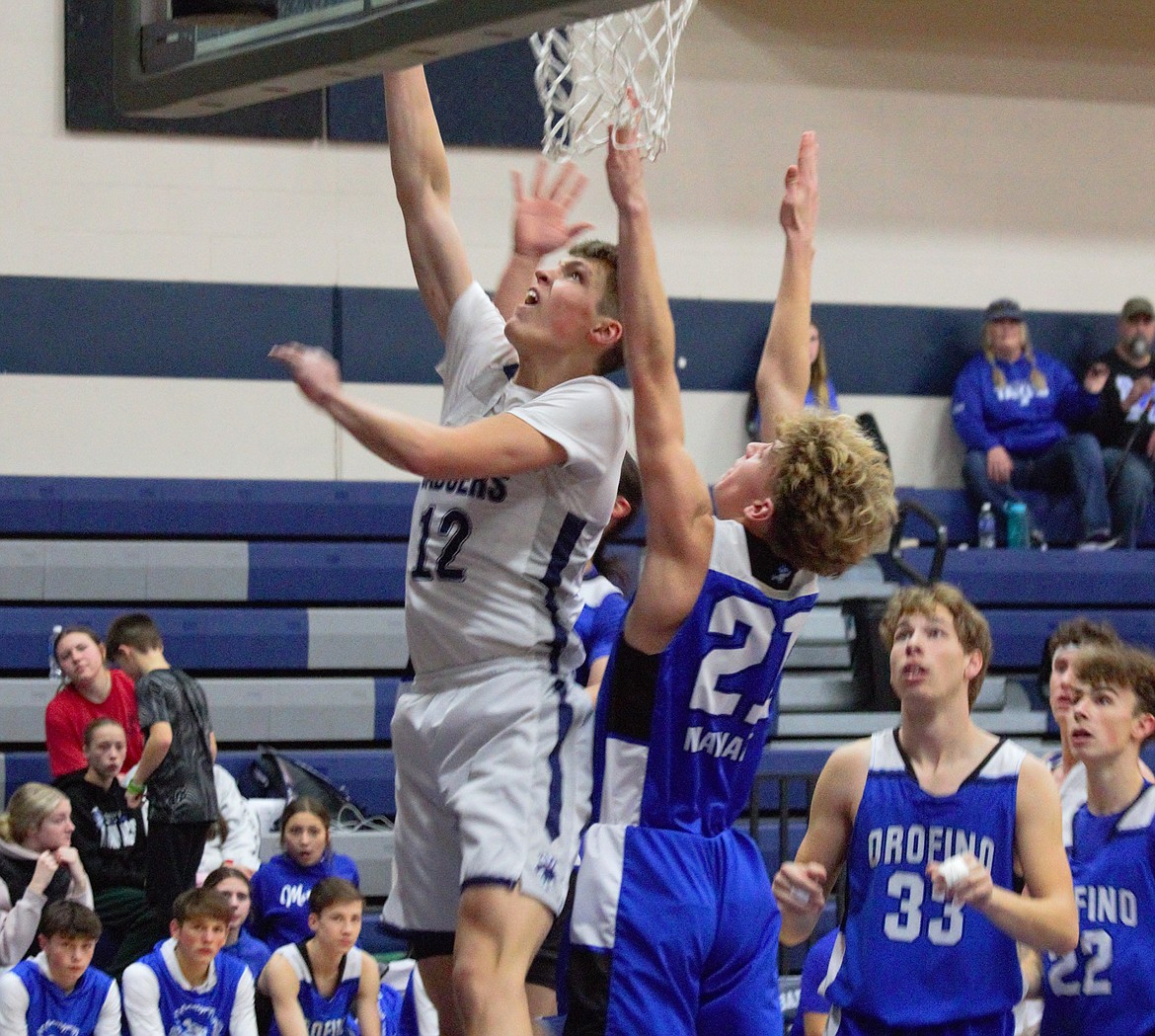 Asher Williams scores a lay-in against Orofino on Dec. 16 in non-league play.