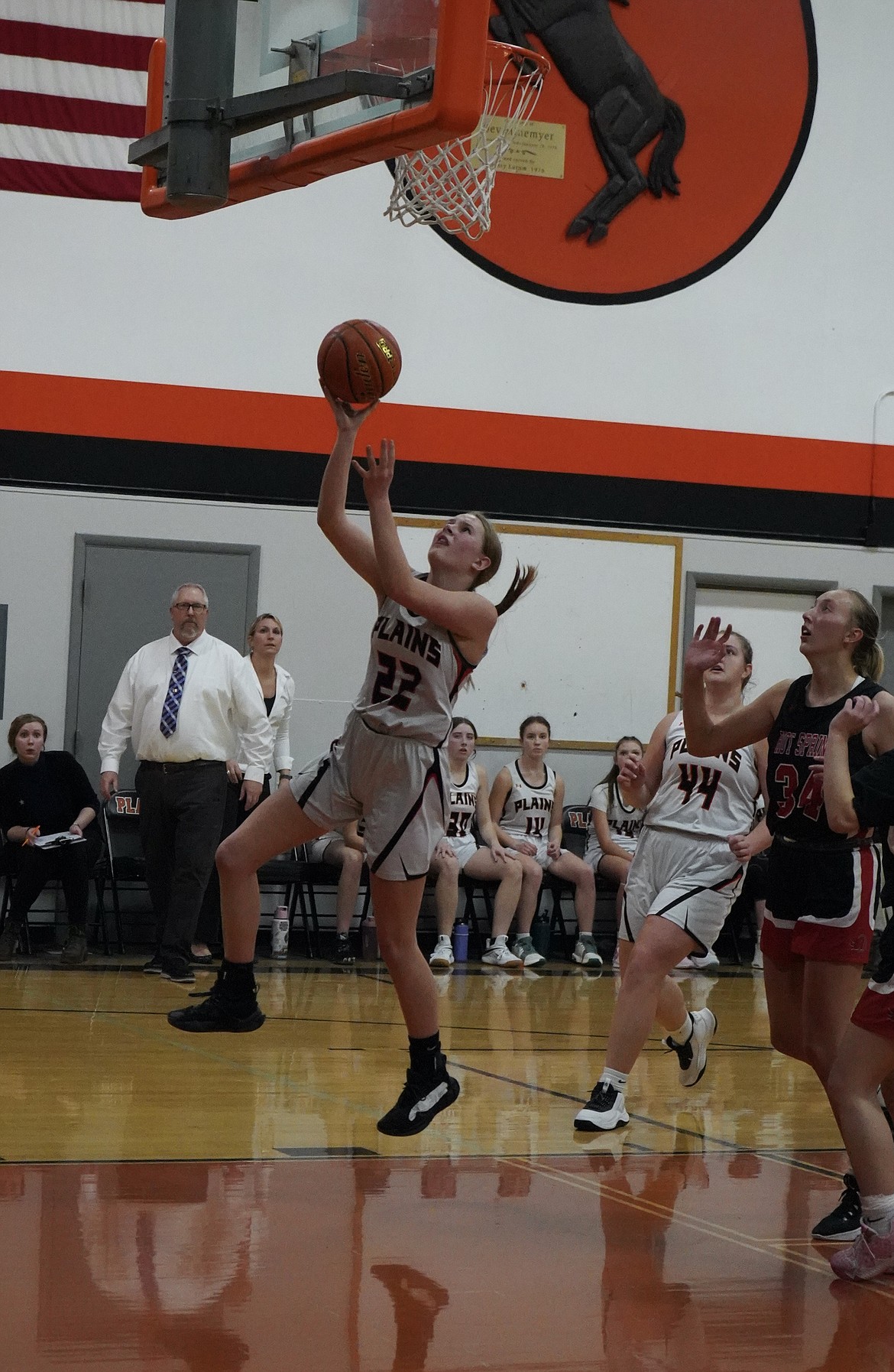 Plains forward Aubrey Butcher goes in for a layup against Hot Springs senior post Lauryn Aldridge Tuesday night during the Trotters overtime win over Hot Springs in Plains.  (Courtesy photo)