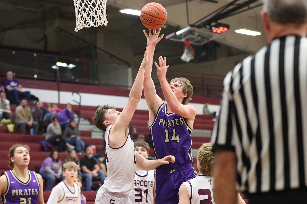 Pirate Brock Henriksen reaches for the basket during last week's game against Butte Central. (Niki Graham photo)