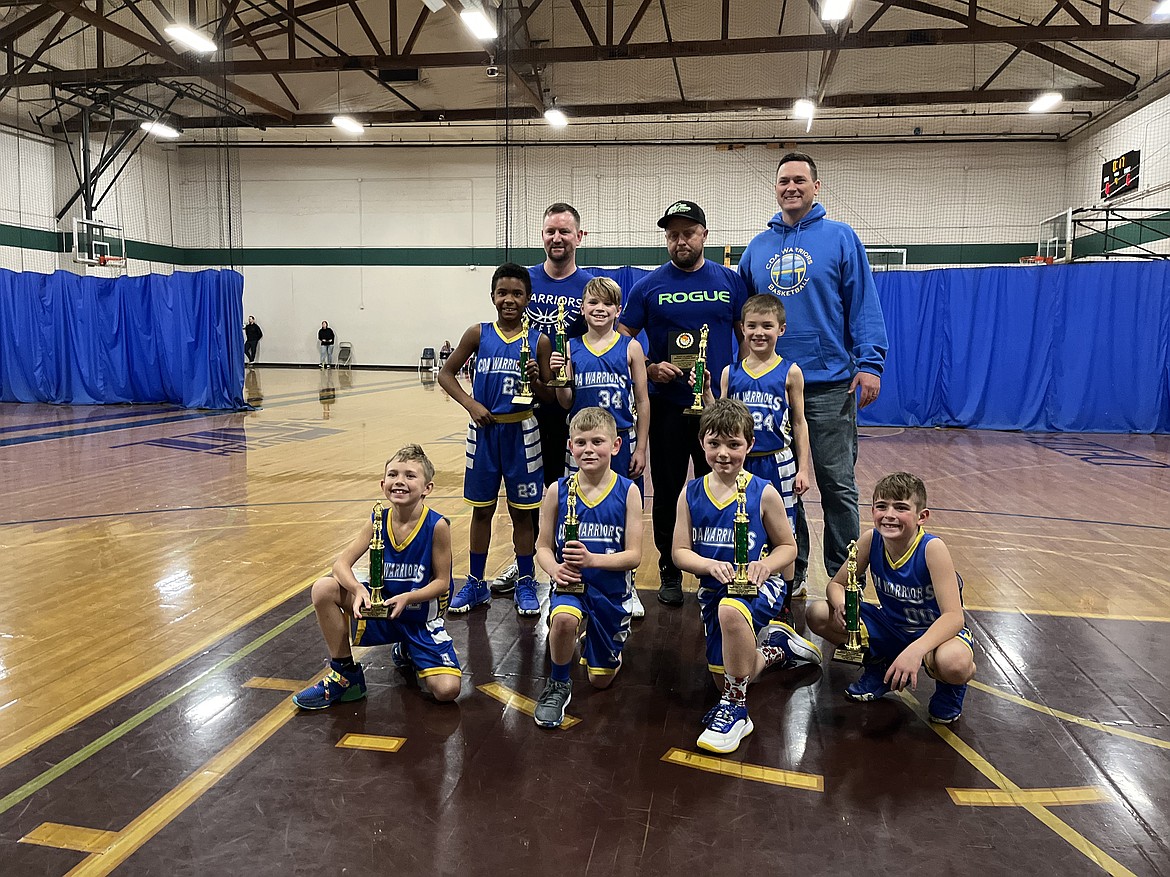 Photo by DARCY WEAVER
The Coeur d'Alene Warriors third grade AAU boys basketball team won its division over the weekend at the Spokane Hoopfest 2023 Santa Slammer Winter Classic basketball tournament at The Warehouse in Spokane. The Warriors opened with a 35-23 win over Grindtime on Saturday, then lost 29-21 to the Sandpoint Future 3B, but ultimately was seeded No. 1 going into bracket play. Sunday morning the Warriors beat the Liberty Knights 32-24, then beat No. 2-seeded Grindtime in the championship game 44-29. In the front row from left are Thor Morrison, Waylon Gardner, Hudson Weaver and Harvey Granier; second row from left, Isaiah Luster, Crew Randklev and Dalton Gregg; and back row from left, coaches Brady Gardner, Mike Gregg and Scott Randklev.