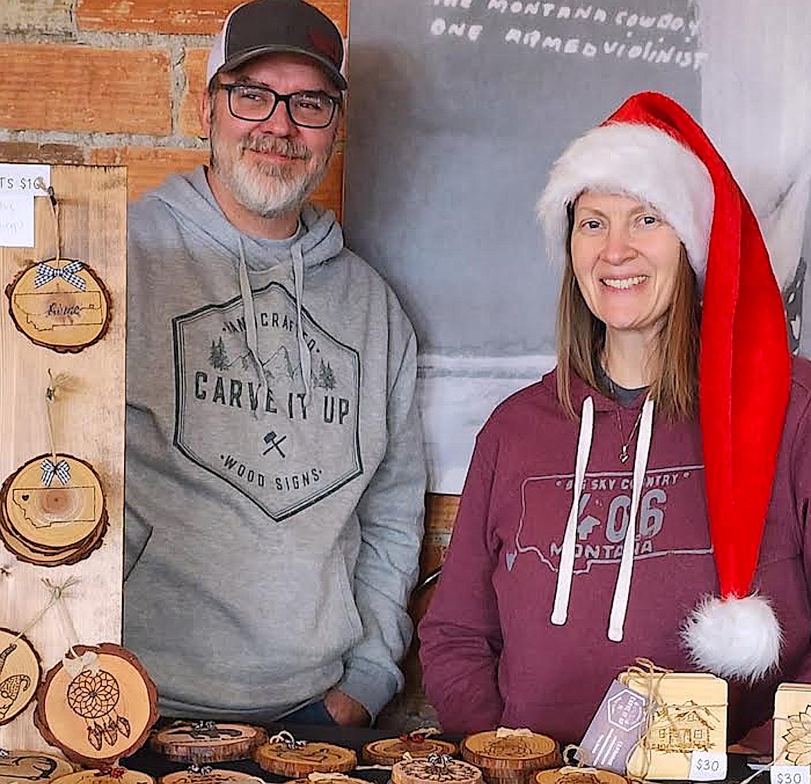 Eric and Misty Reinhardt from Carve it Up brought their unique woodcarving/woodburning pieces for a Cottage business and Craft show at Maxine's on Main street. (Berl Tiskus/Leader)