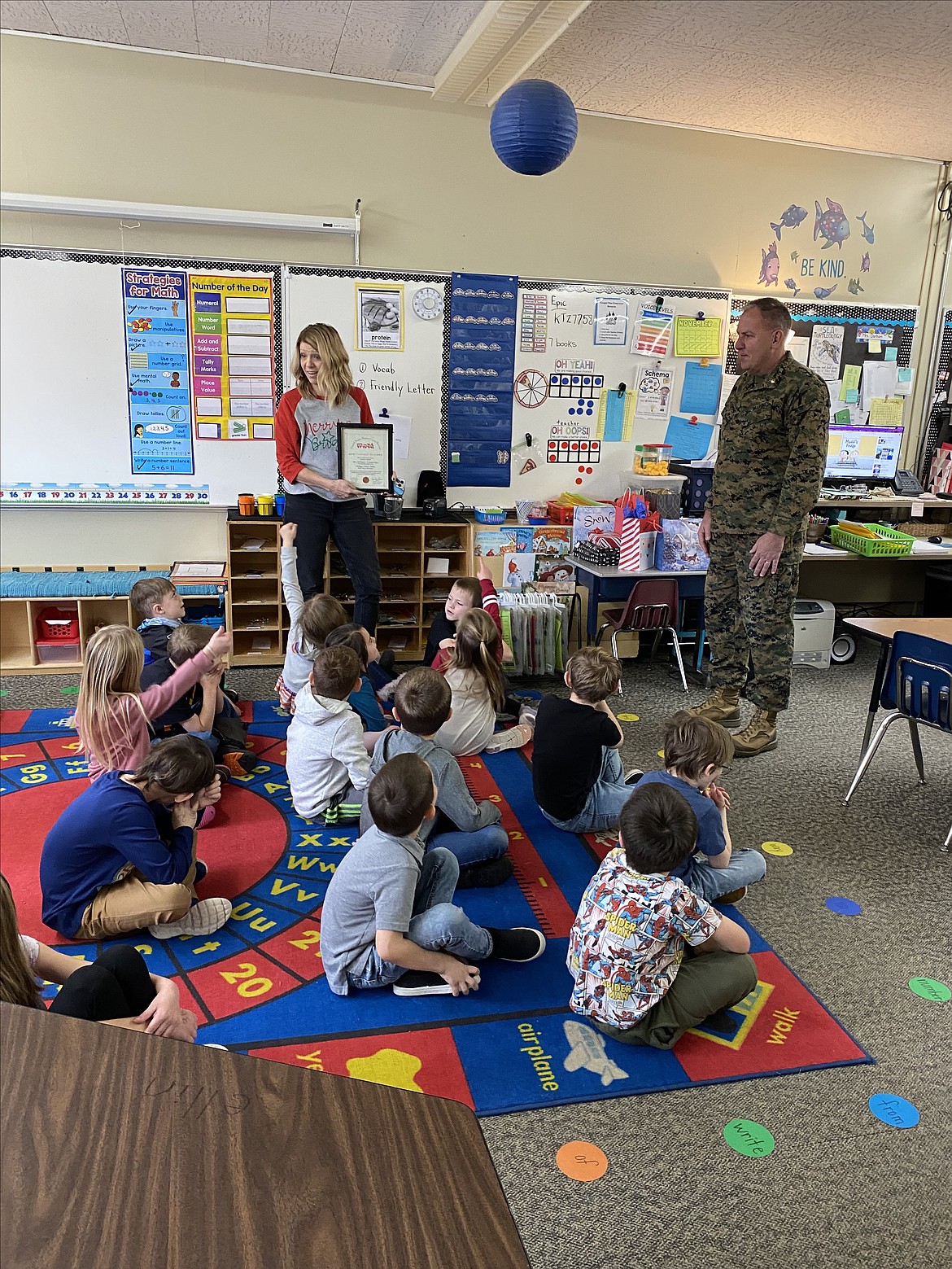 First graders in Jackie Durham's class at Canyon Elementary point where they want their Toys for Tots certificate to hang in the classroom when it was presented by 

Major Craig Petersen, Kellogg HS JROTC, Zoie Lawson, Tessa Hodgman-Ricter, Josh Salvador, and Mattix Harris.