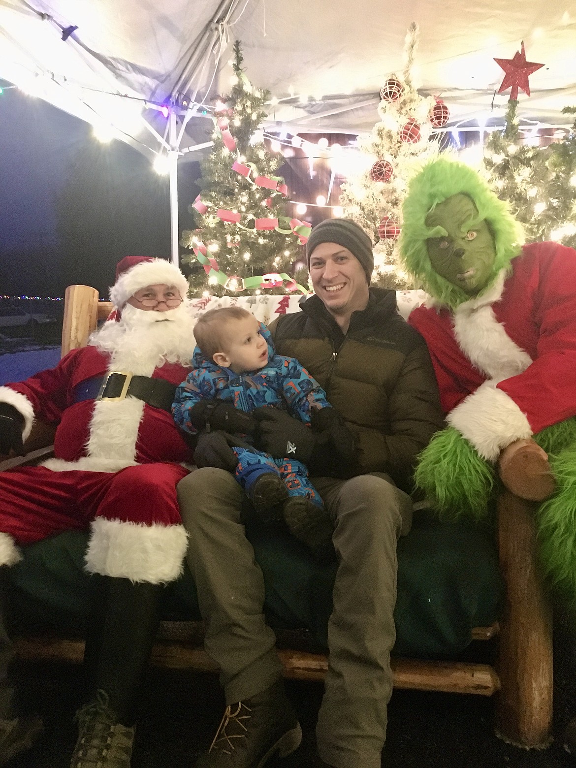 Santa and his greener grumpier friend in a red suit were on hand Monday night for families to take photos. (Mineral Independent/Amy Quinlivan)