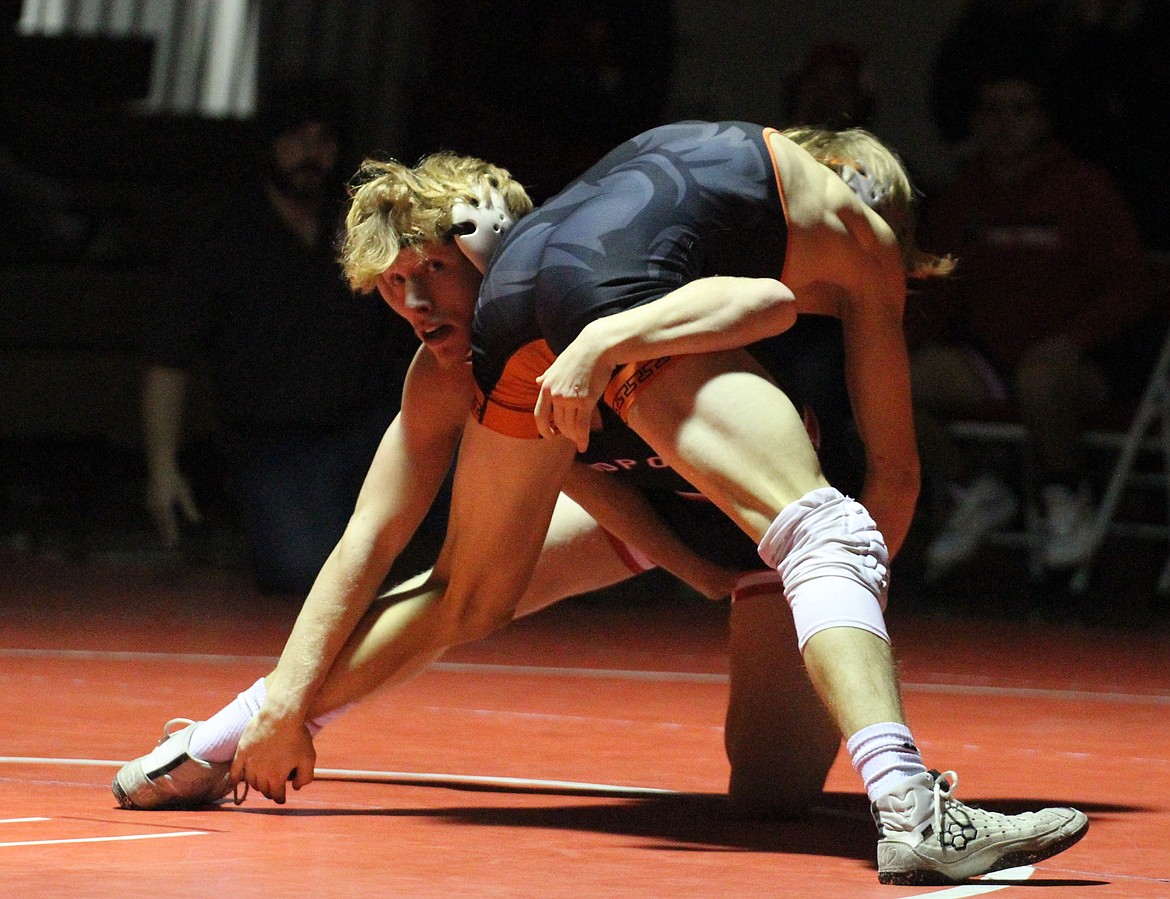 Sandpoint's Shane Sherrill plots his next move against Priest River's Colm McLaimtaig. Sherrill eventually won via pin (1:40) in the third period.