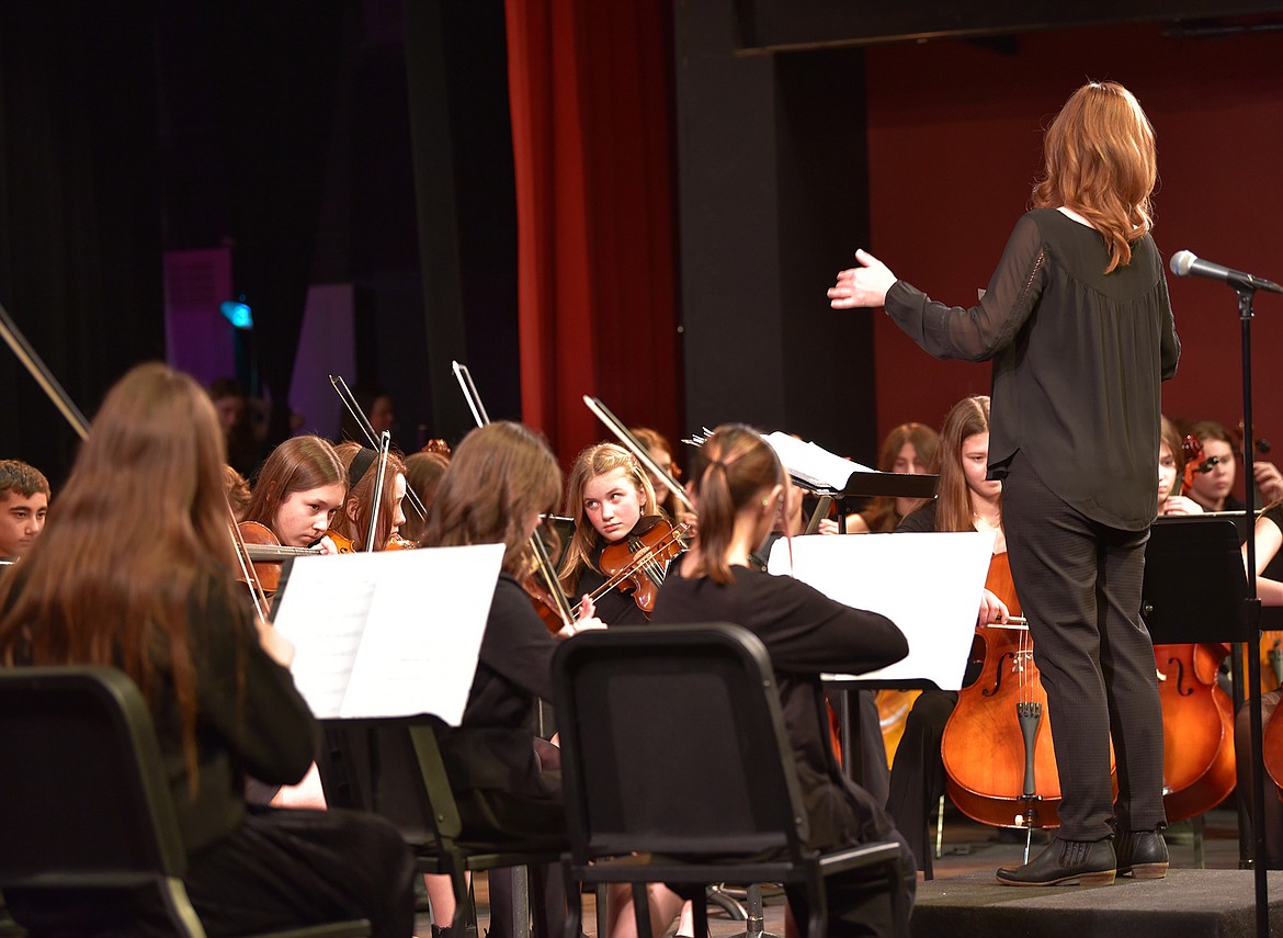 Eighth grader Elsa Shigo looks to the other strings as she plays the viola during an orchestra concert. (Julie Engler/Whitefish Pilot)