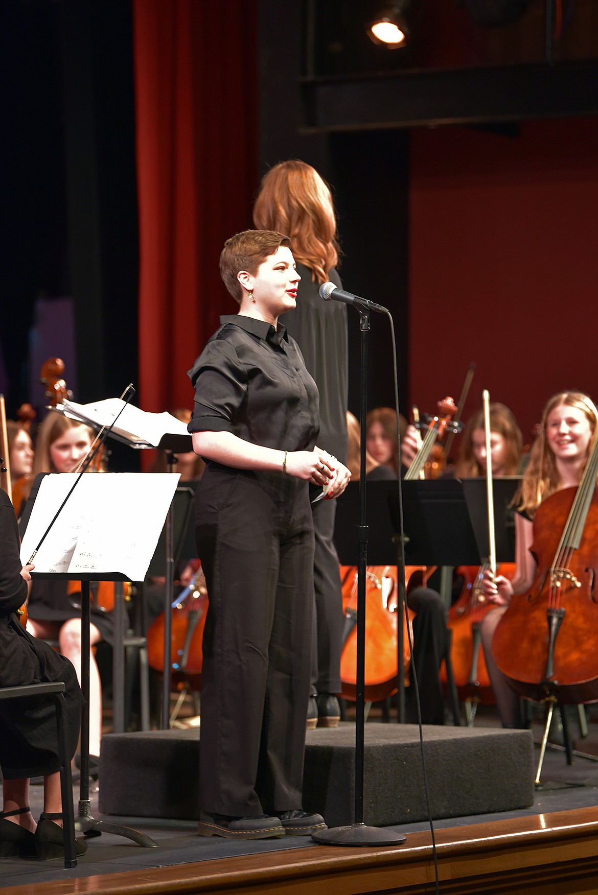 Mosby Stiffler, bass player, introduces a piece at the eighth grade orchestra concert. (Julie Engler/Whitefish Pilot)