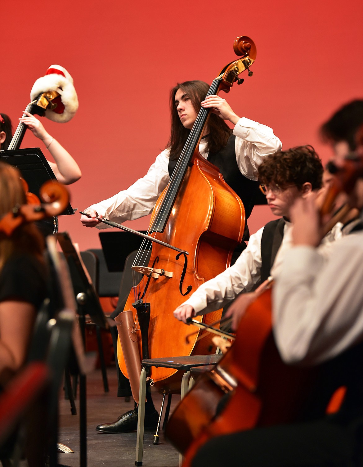Junior Holden Coleman plays bass for the WHS orchestra. (Julie Engler/Whitefish Pilot)
