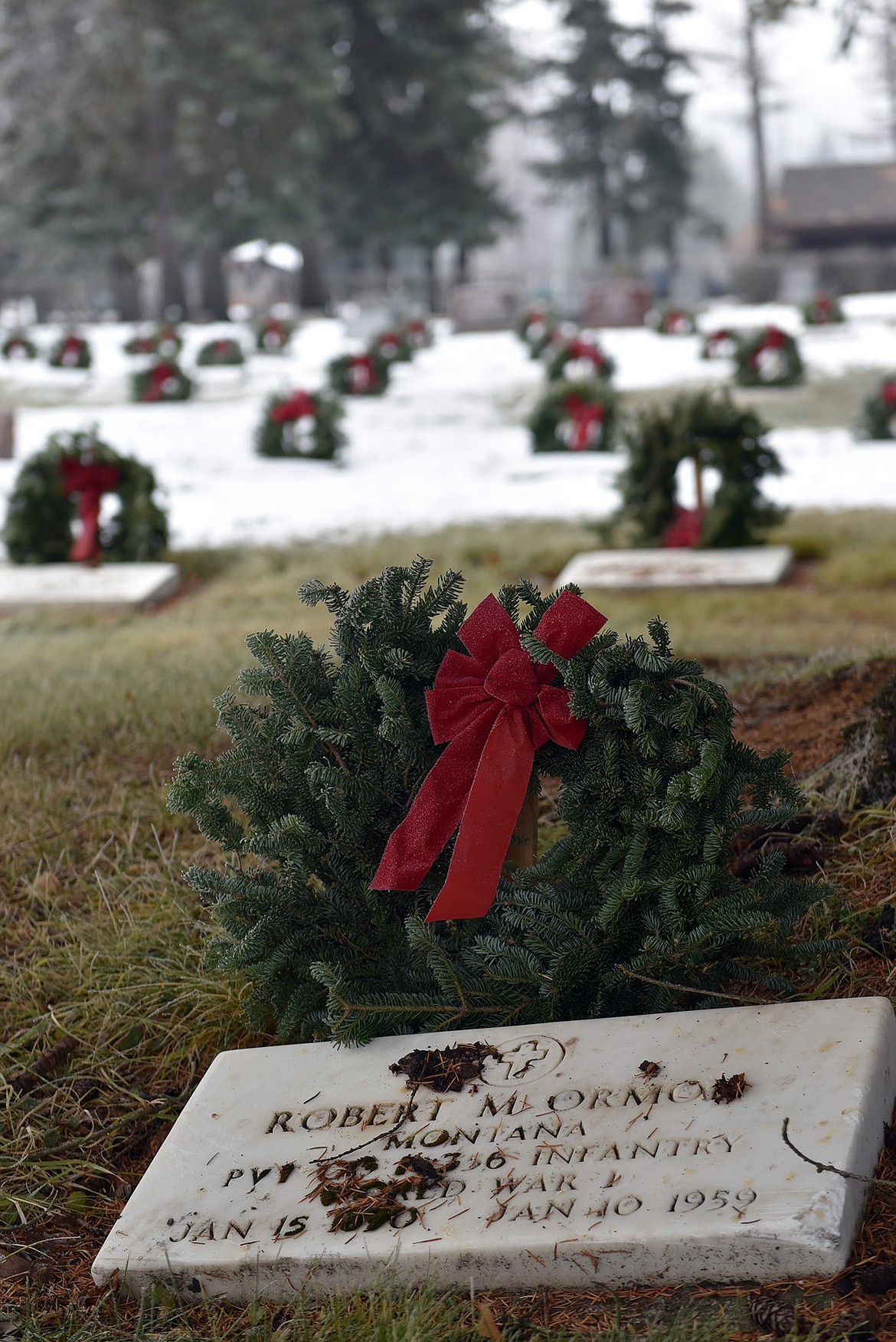 Wreaths warm the markers at the Whitefish Cemetary. (Julie Engler/Whitefish Pilot)