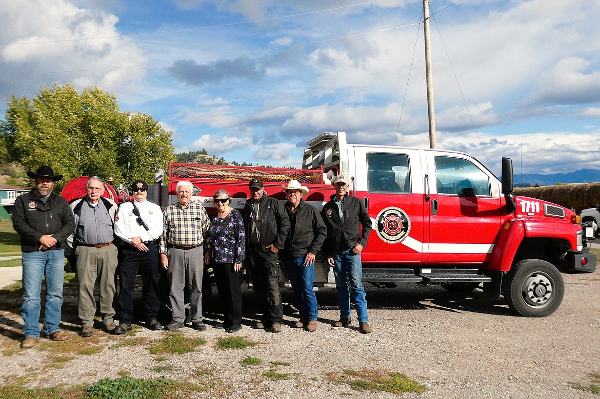 Donors and recipients of Chief Cliff Fire Service's new Kodiak truck include Brendeon Schoening, who brokered the deal, Fred Nelson and Chief Will Woodger of Polson Rural Fire, benefactors Jim and Donna Pomajevich, and Chief Cliff Chief Andy Learn and trustees Sigurd Jensen and Mike Meuli. (Courtesy photo)