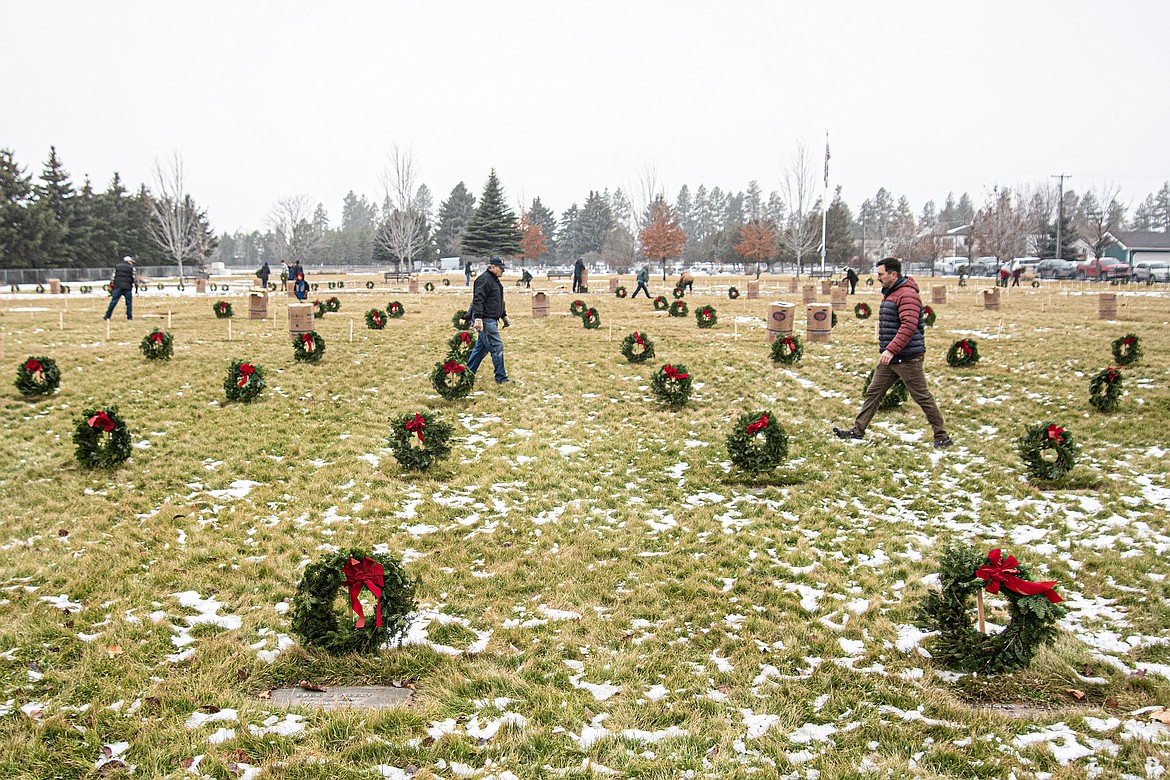 Volunteers place wreaths on every grave at the Montana Veterans Home cemetery thanks to the Wreaths Across America program on Saturday, Dec. 16. (Avery Howe photo)