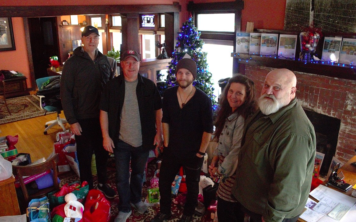 Coldwell Banker North Woods Realty realtors with the many gifts donated for the "angel tree."