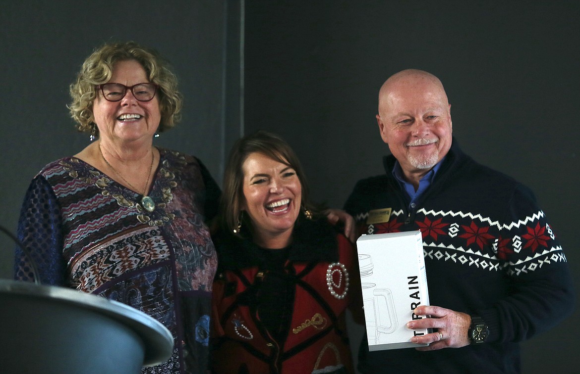 Post Falls Chamber President Christina Petit, center, honors outgoing board members Julie Holt and Jerry Lyon for their service and mentorship during Tuesday's chamber meeting at Prairie Falls Golf Club.