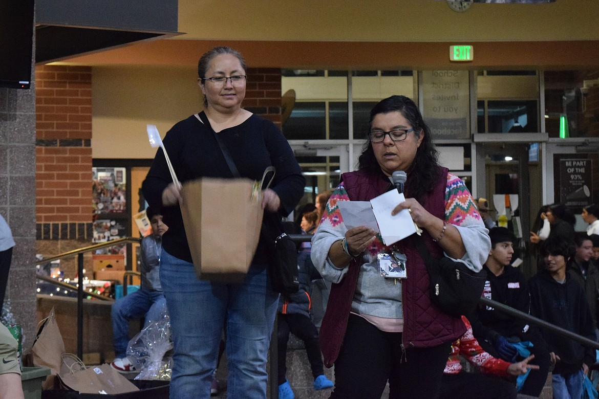 Mattawa City Council member Fabiola Hernandez and Mayor Maria Celaya announce raffle winners.