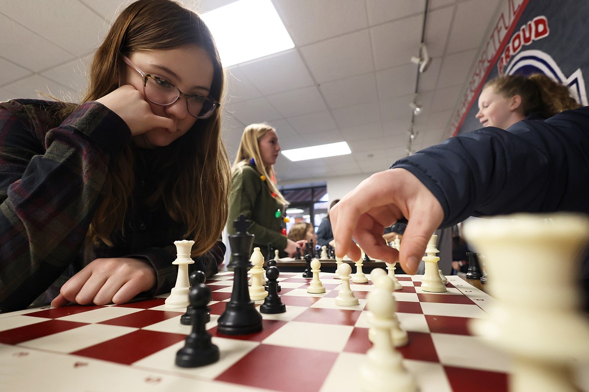 Nevaeh Rehbein contemplates her next move as the Bigfork Middle Chess club plays last week. (Jeremy Weber/Bigfork Eagle)