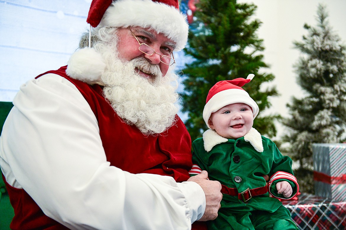 A baby visits with Santa Claus during Logan Health Children's Cookies and Cocoa with Santa event on Wednesday, Dec. 20. (Casey Kreider/Daily Inter Lake)
