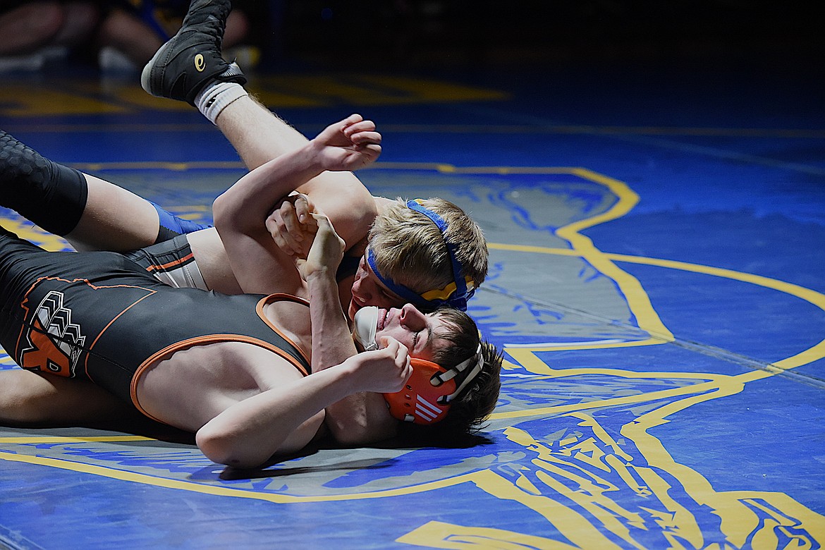 Libby's Marley Erickson has Ronan's Jairyn Krause right where he wants him for a pin in the match at 138 pounds on Tuesday, Dec. 19, in Libby. (Scott Shindledecker/The Western News)