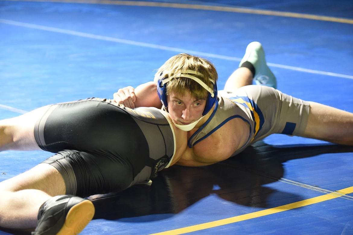 Libby's Tanner Wolfe pinned Stevensville's Cody Umland in just 56 seconds in the match at 160 pounds on Tuesday, Dec. 19, in Libby. (Scott Shindledecker/The Western News)