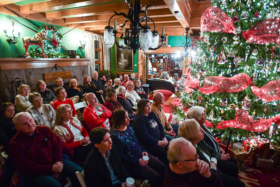 Attendees listen to the Valley Voices Community Choir's Evensong sing Christmas Carols at Conrad Mansion on Tuesday, Dec. 19. (Casey Kreider/Daily Inter Lake)