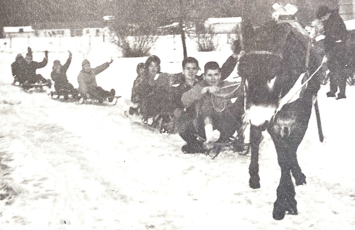 Pete the Donkey pulls neighborhood kids on Jackass Lane, from right: Larry Wright, 14, Craig Ziegler, 13, Kerrie Fitch, 6, Peg Wright, 12, Jodie Fitch, 2 ½, Chris Fitch, 7, Jay Lakamp, 7, Jarry Lakamp, 5 ½, John King, 10, and Steve Wright, 10.