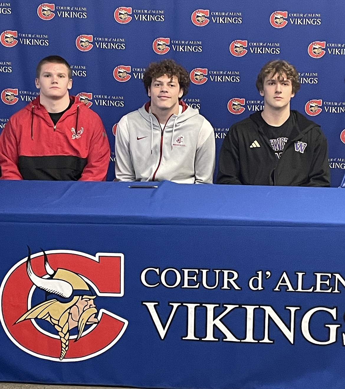 JASON ELLIOTT/Press
From left: Coeur d'Alene seniors Shea Robertson, Camden DeGraw and Jace Eastlick signed letters of intent to play football at the Division I level on Thursday. Robertson signed with Eastern Washington, McGraw at Washington State and Eastlick at Washington.