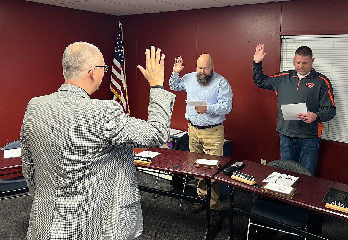 Newly elected Ephrata School Board Directors Mike Fleurkins and Josh Sainsbury are sworn in during Monday’s regular meeting.