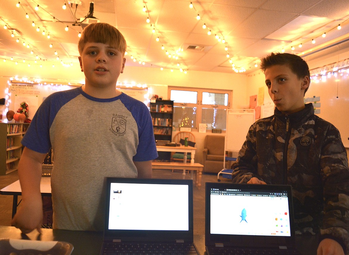 Ben Clubb, left, designed a dome to protect his space colony in Mandi Ferguson's class. Noah Miller, right, designed a rocket ship in a digital design program called Tinkercad.