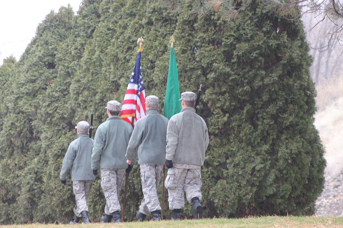 Members of the local Civil Air Patrol march into the Wreaths Across America ceremony with the nation and state colors on display.